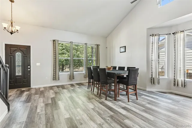 a view of a dining room with furniture window and outside view