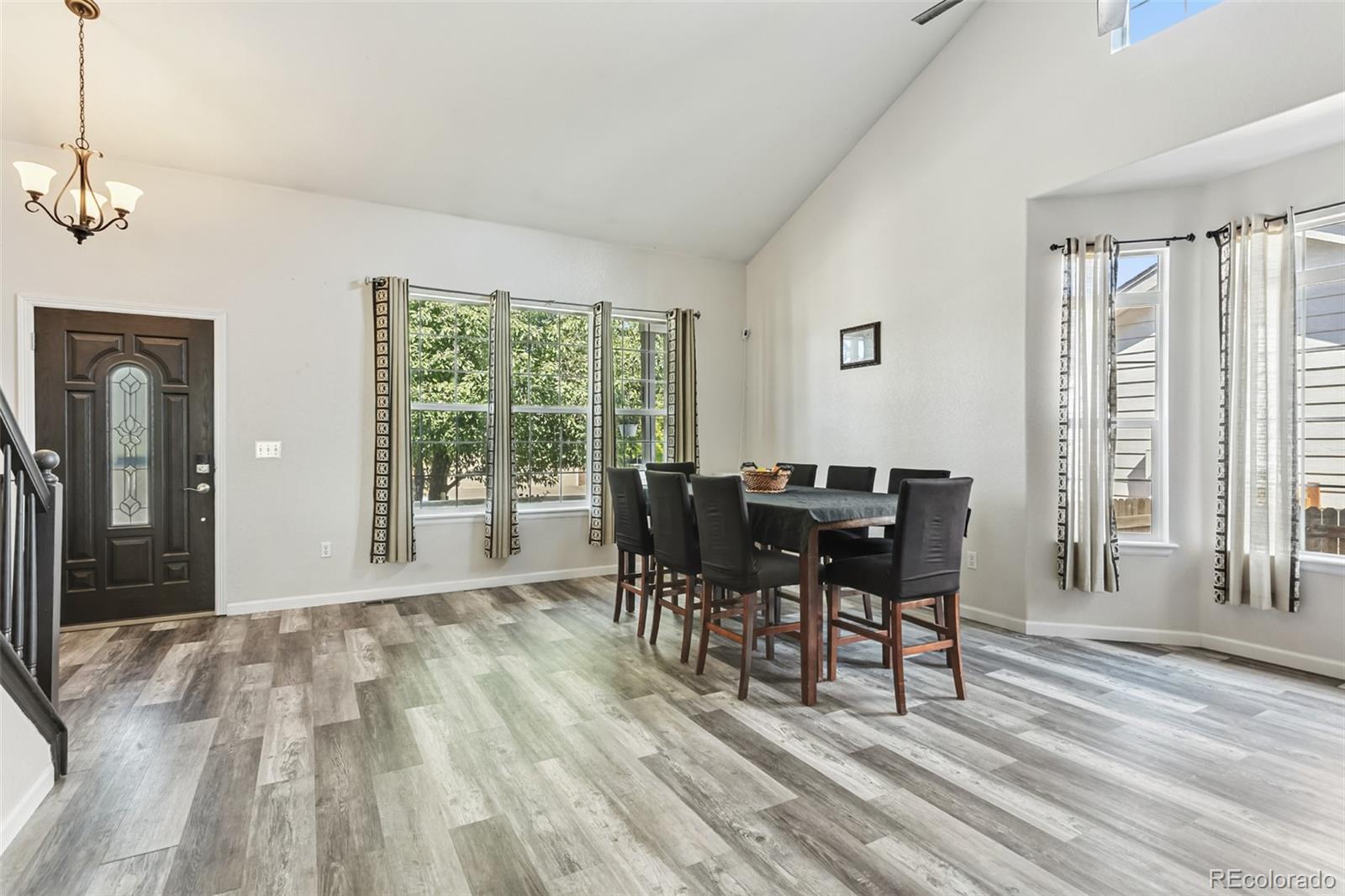 334 Octillo Street Brighton, CO 80601 - Photo 6 of 39 a view of a dining room with furniture window and outside view