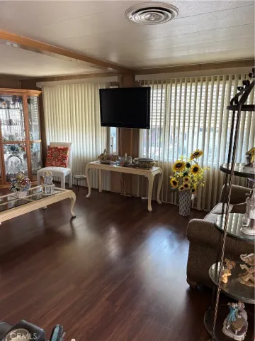 a living room with furniture window and wooden floor