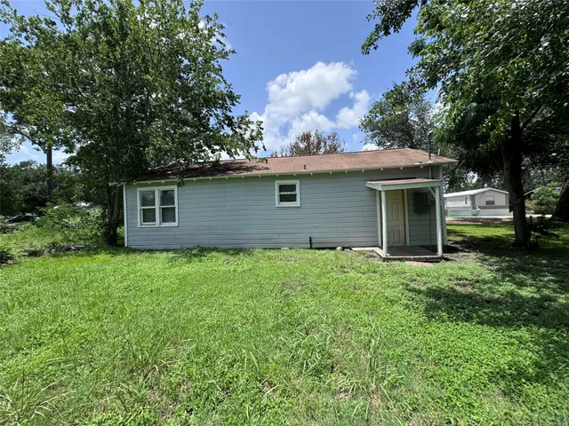 a house with a tree in front of it