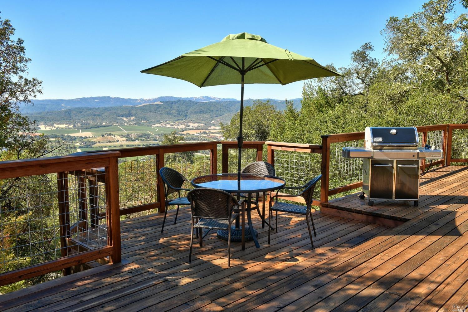 a view of a roof deck with furniture