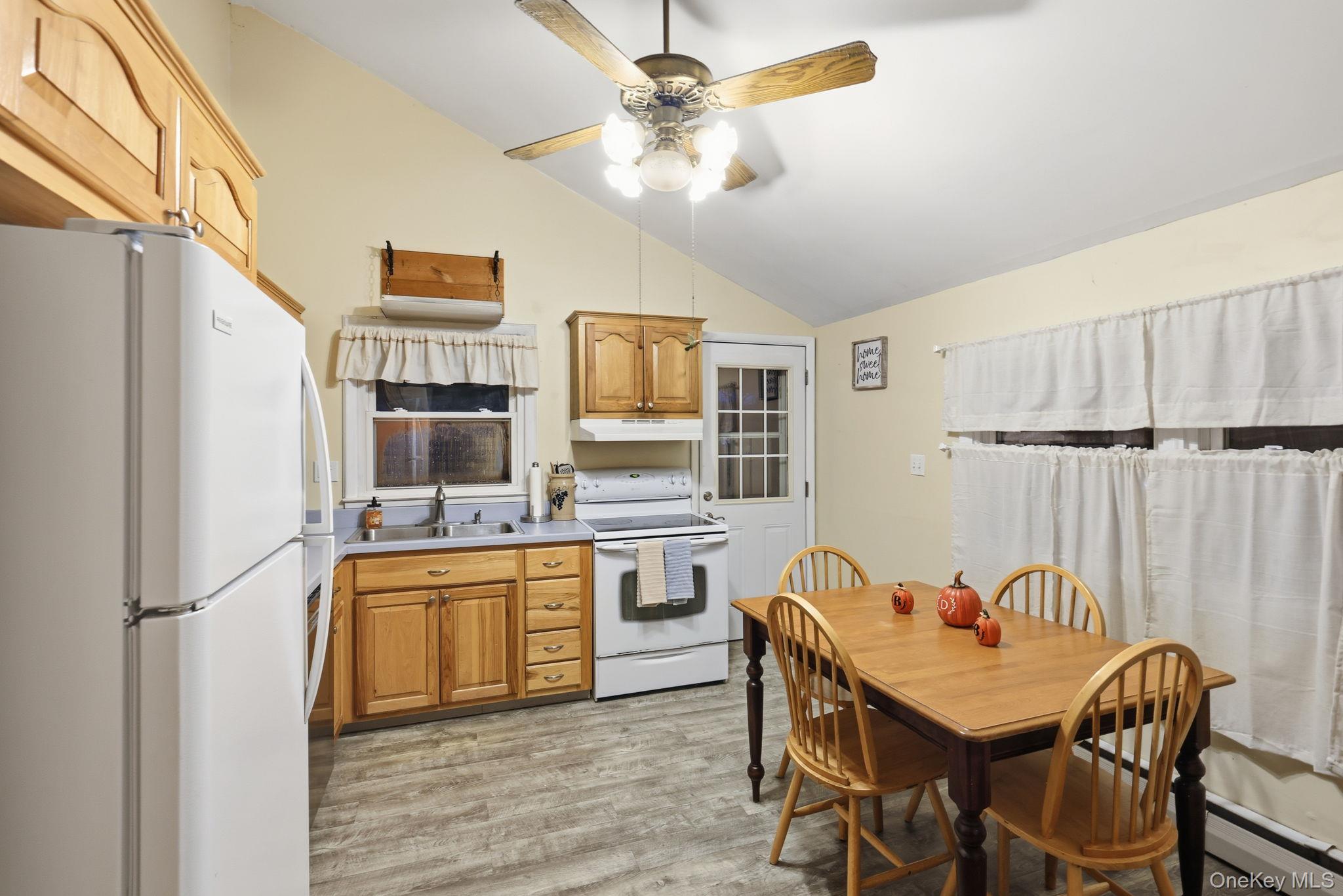 6 Liss Road Wappingers Falls, NY 12590 - Photo 12 of 28 a kitchen with stainless steel appliances granite countertop a stove a sink dishwasher a refrigerator with a dining table and chairs
