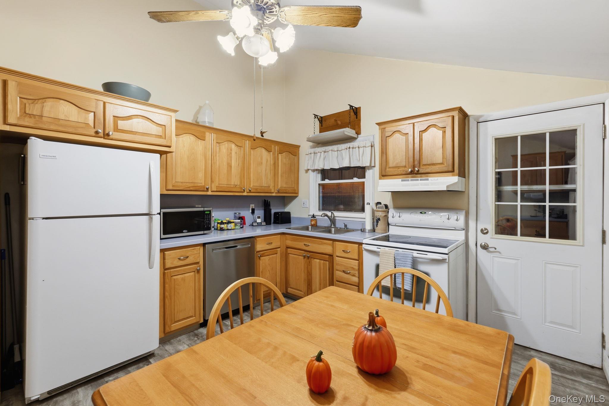 6 Liss Road Wappingers Falls, NY 12590 - Photo 13 of 28 a kitchen with stainless steel appliances granite countertop a sink refrigerator stove and microwave
