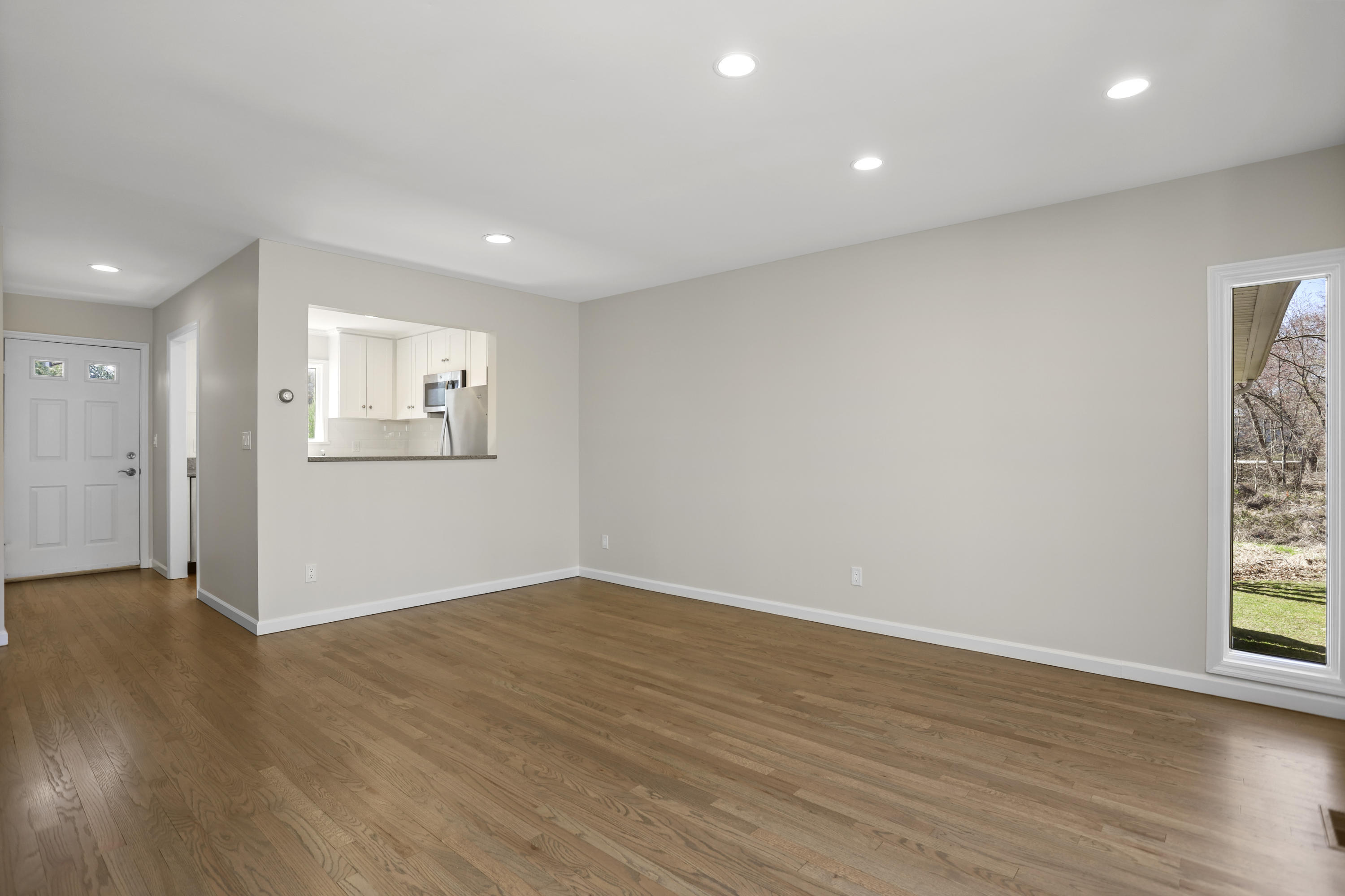 36 Decatur Street, Unit 2 Cos Cob, CT 06807 - Photo 12 of 30 a view of an empty room with wooden floor and a window