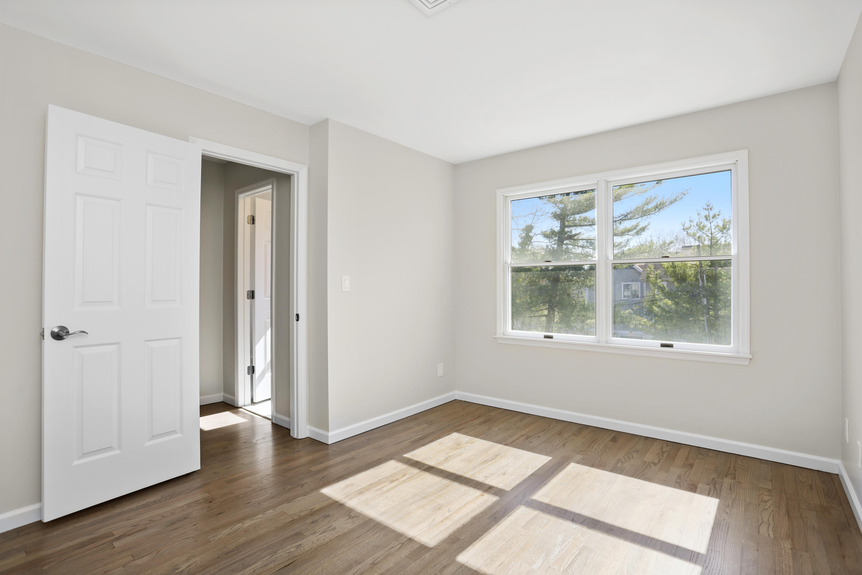 36 Decatur Street, Unit 2 Cos Cob, CT 06807 - Photo 14 of 30 an empty room with wooden floor and windows