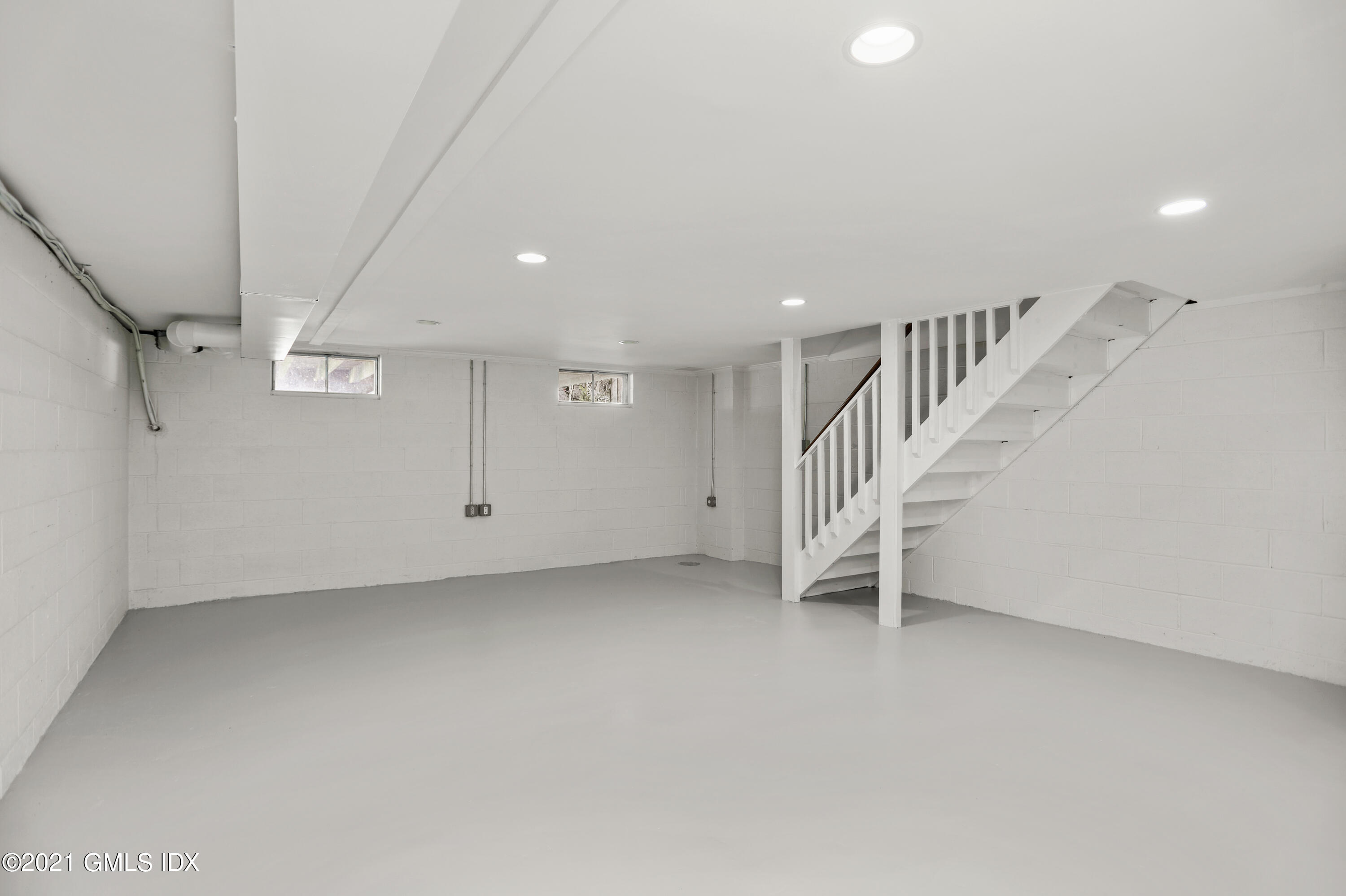 36 Decatur Street, Unit 2 Cos Cob, CT 06807 - Photo 22 of 30 a view of an empty room with stairs