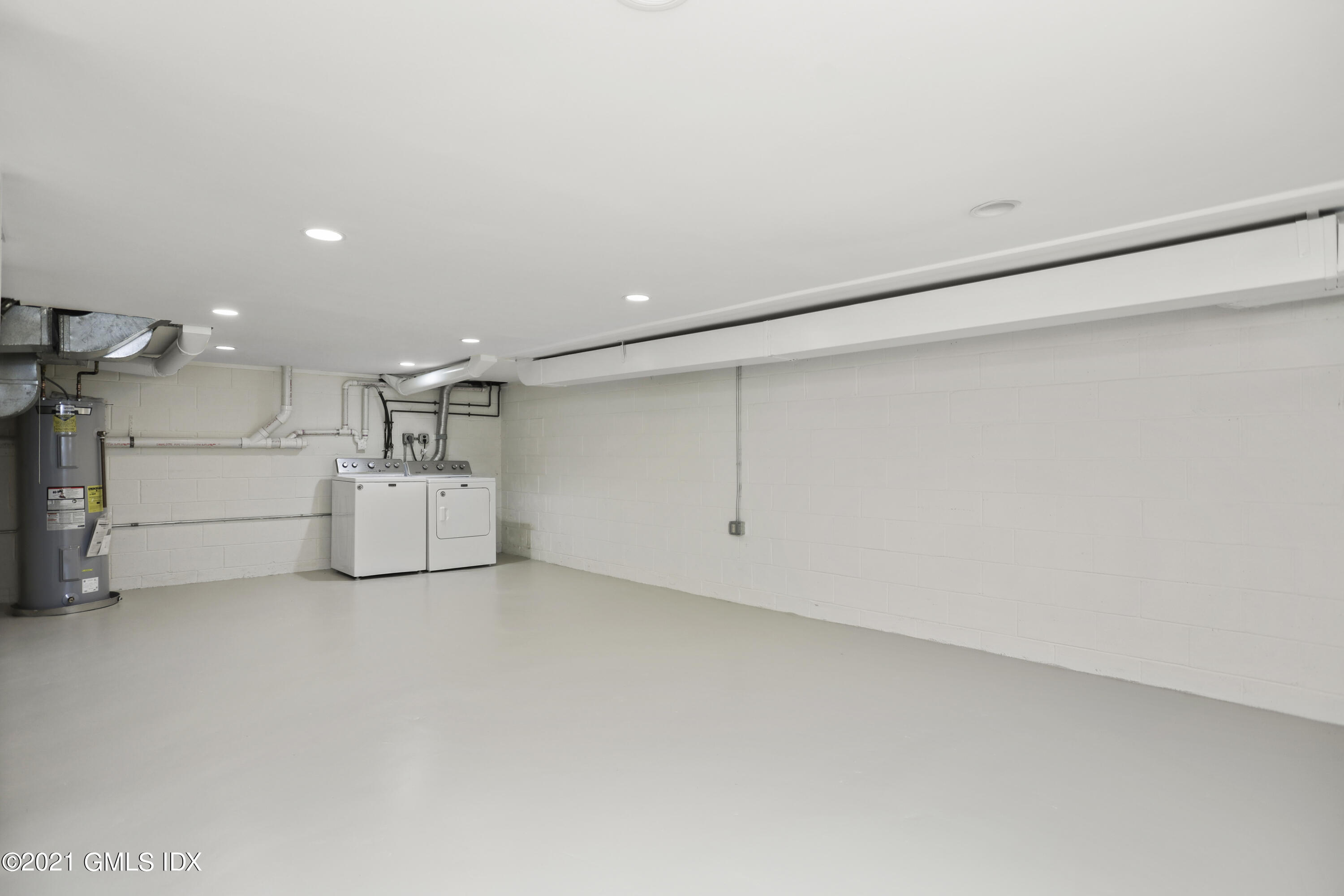 36 Decatur Street, Unit 2 Cos Cob, CT 06807 - Photo 23 of 30 a view of a big room with white walls
