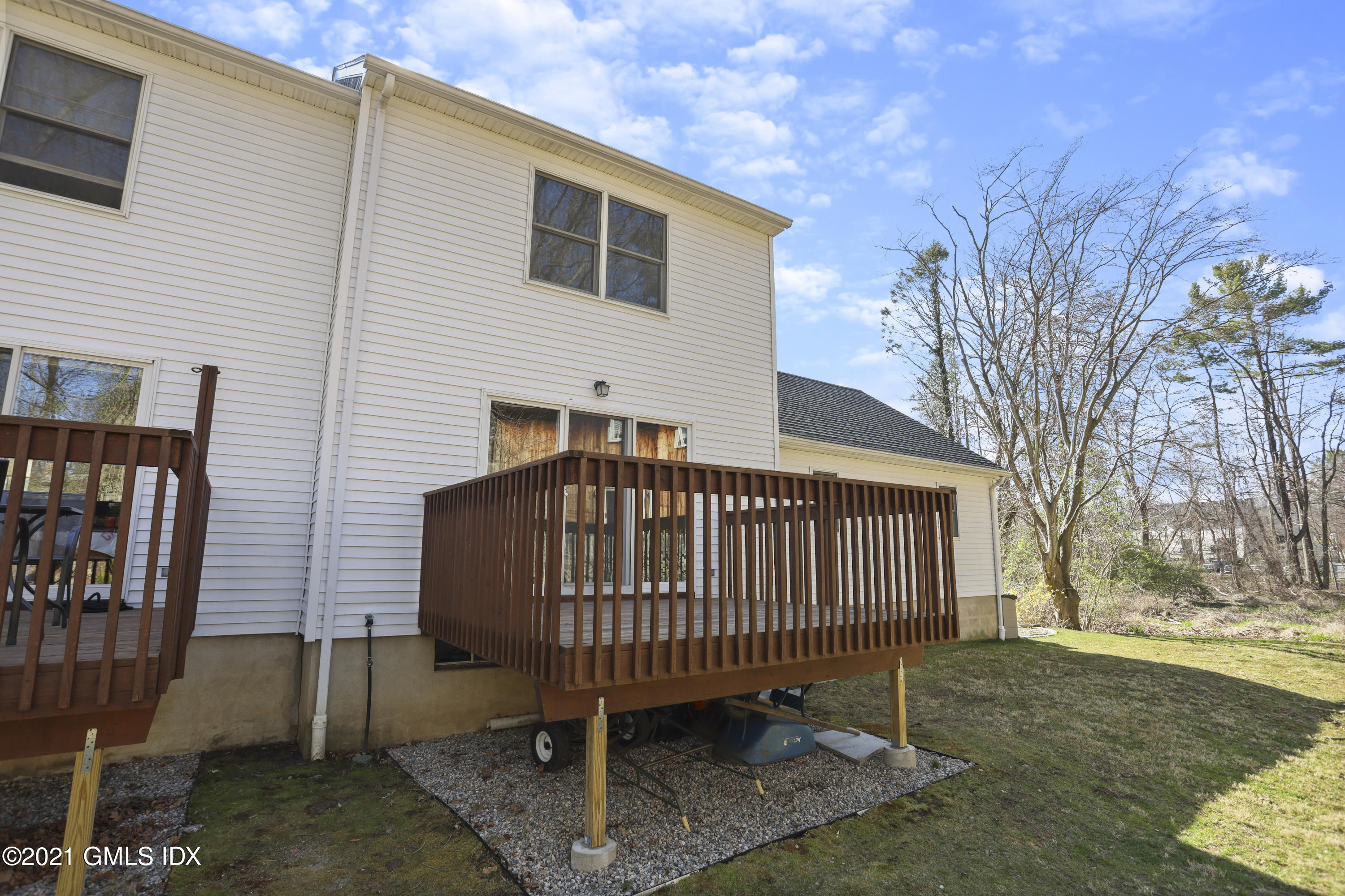 36 Decatur Street, Unit 2 Cos Cob, CT 06807 - Photo 25 of 30 a view of a house with a yard and deck