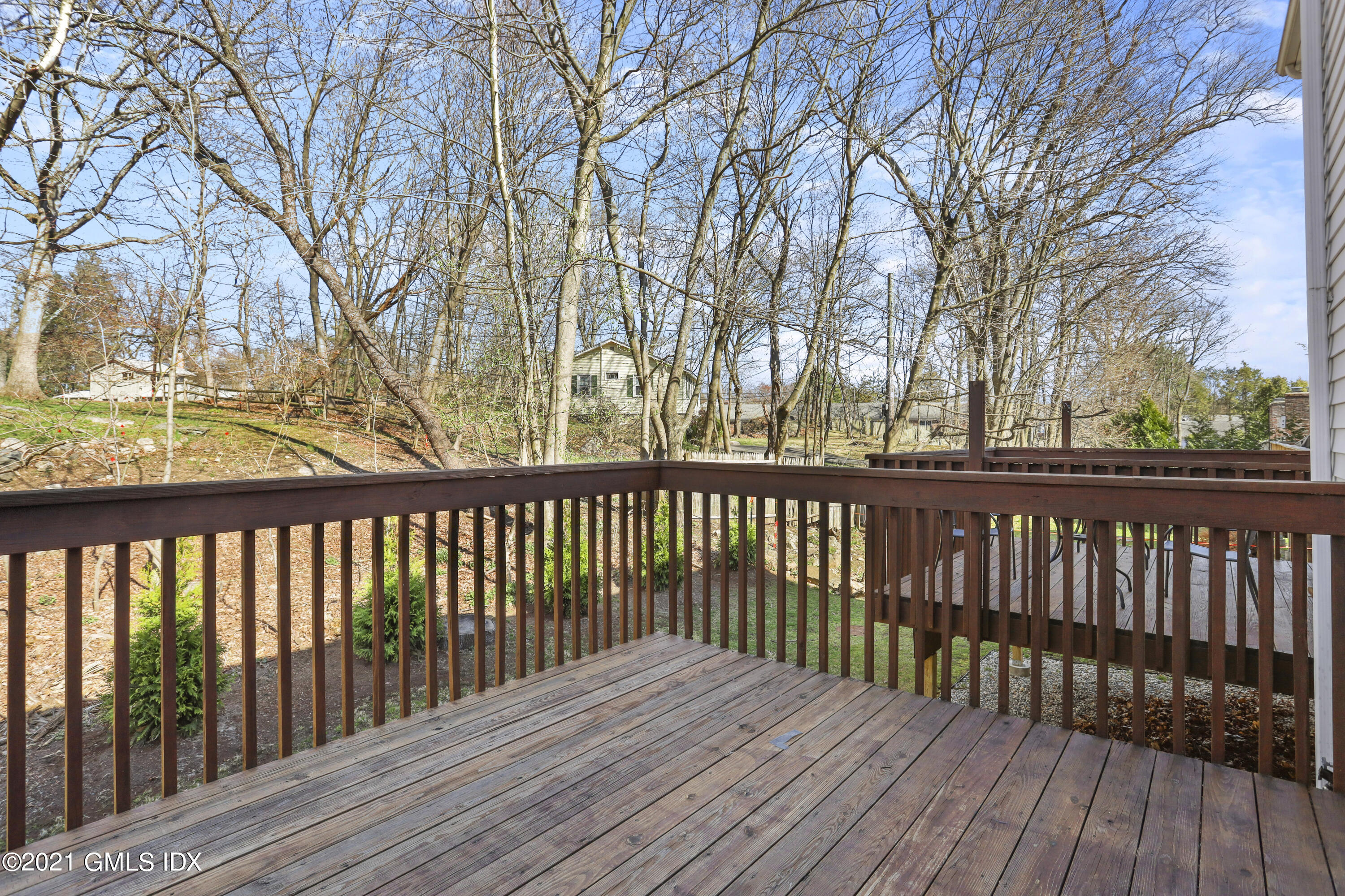 36 Decatur Street, Unit 2 Cos Cob, CT 06807 - Photo 29 of 30 a view of wooden balcony with trees