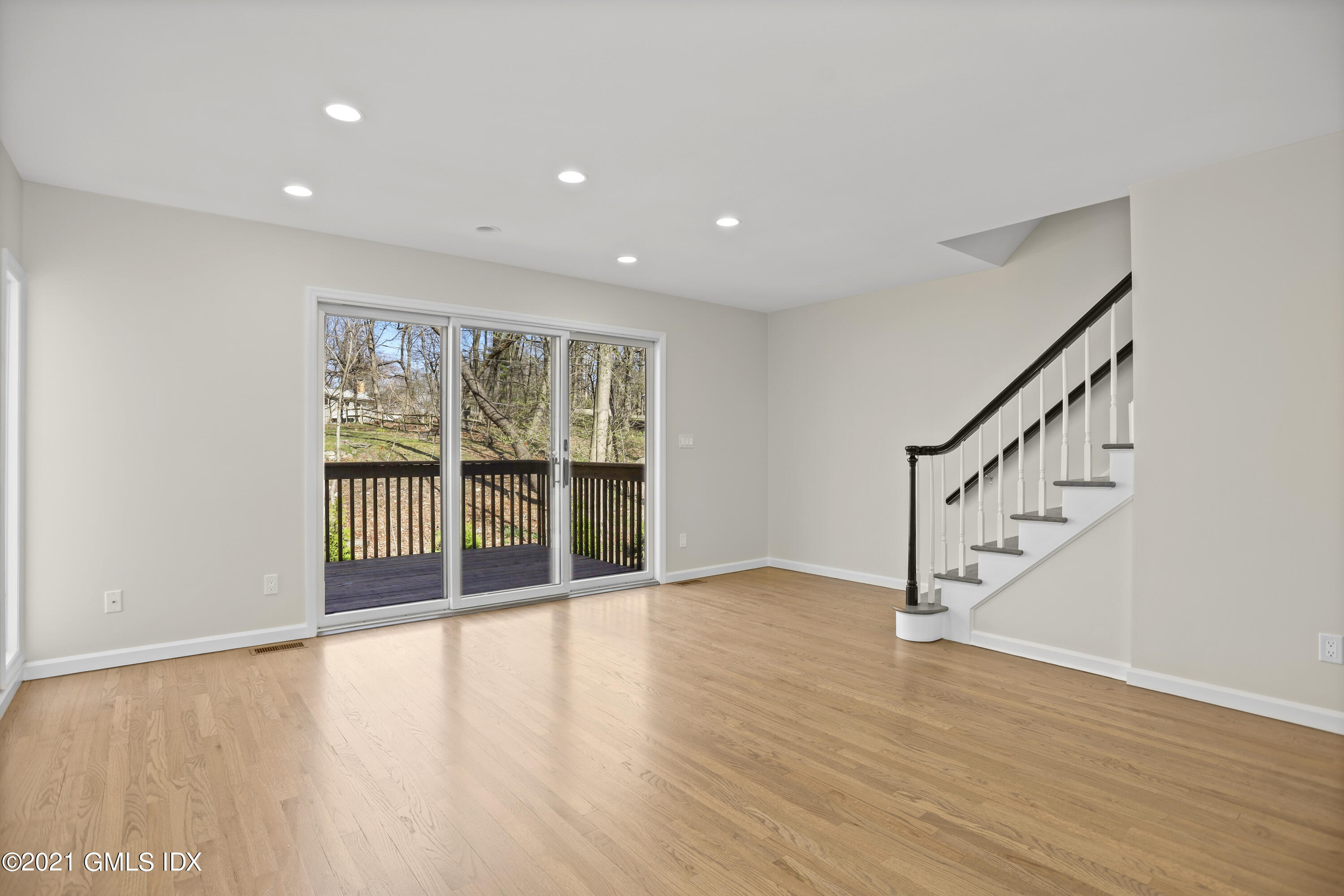 36 Decatur Street, Unit 2 Cos Cob, CT 06807 - Photo 9 of 30 a view of an empty room with wooden floor and a window