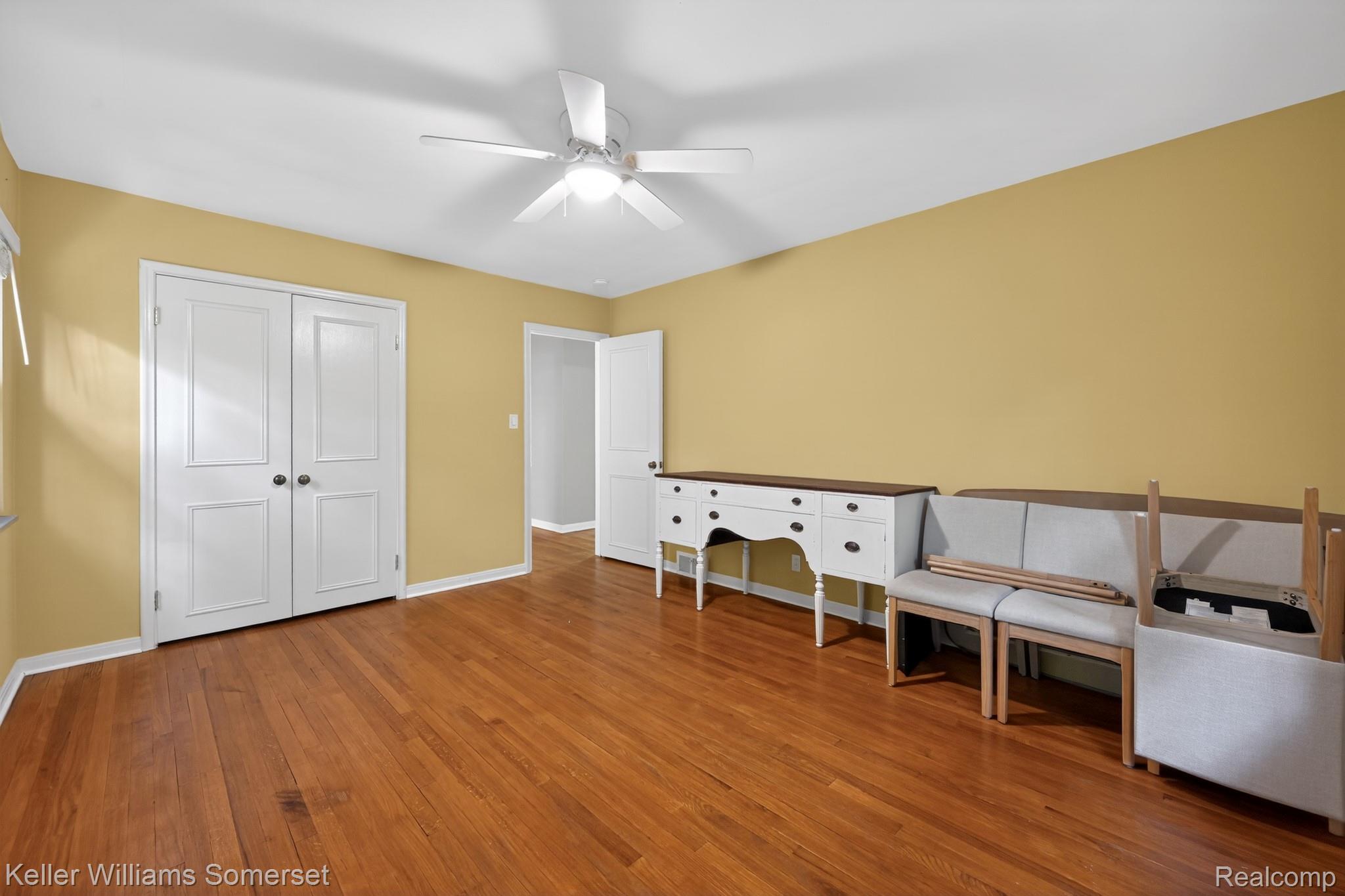 1681 Oxford Road Grosse Pointe, MI 48236 - Photo 13 of 25 Unfurnished bedroom featuring hardwood / wood-style flooring, ceiling fan, and a closet