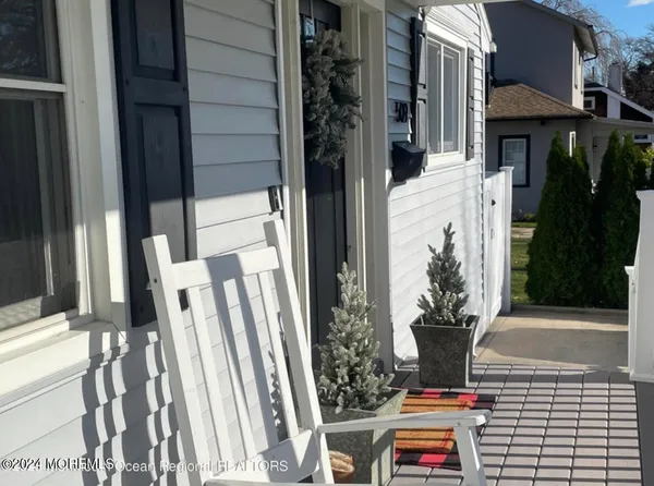 a potted plant sitting in front of a house