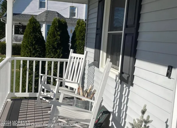 a view of balcony with furniture
