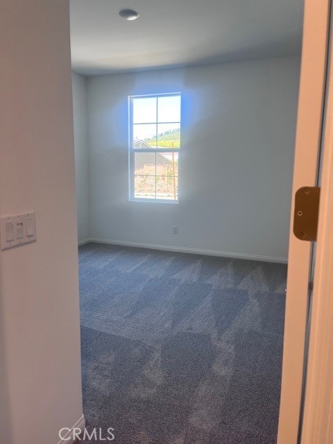 24309 Arroyo Drive Menifee, CA 92584 - Photo 17 of 19 an empty room with windows