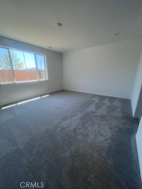24309 Arroyo Drive Menifee, CA 92584 - Photo 10 of 19 an empty room with windows