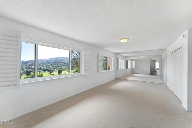 a view of livingroom with furniture and front door
