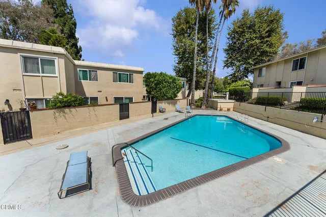 an aerial view of a house with swimming pool