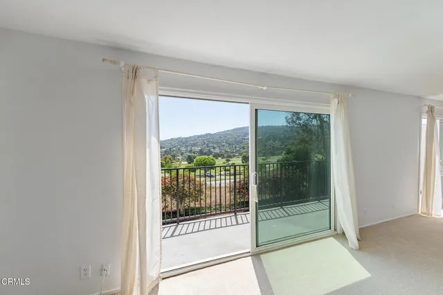 a view of a room that has a glass door