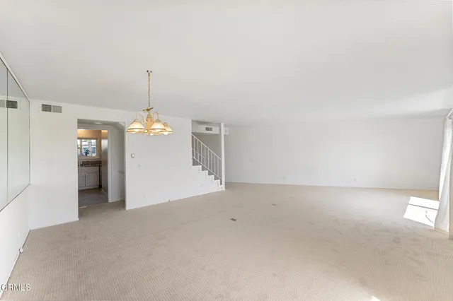 a view of empty room with a windows