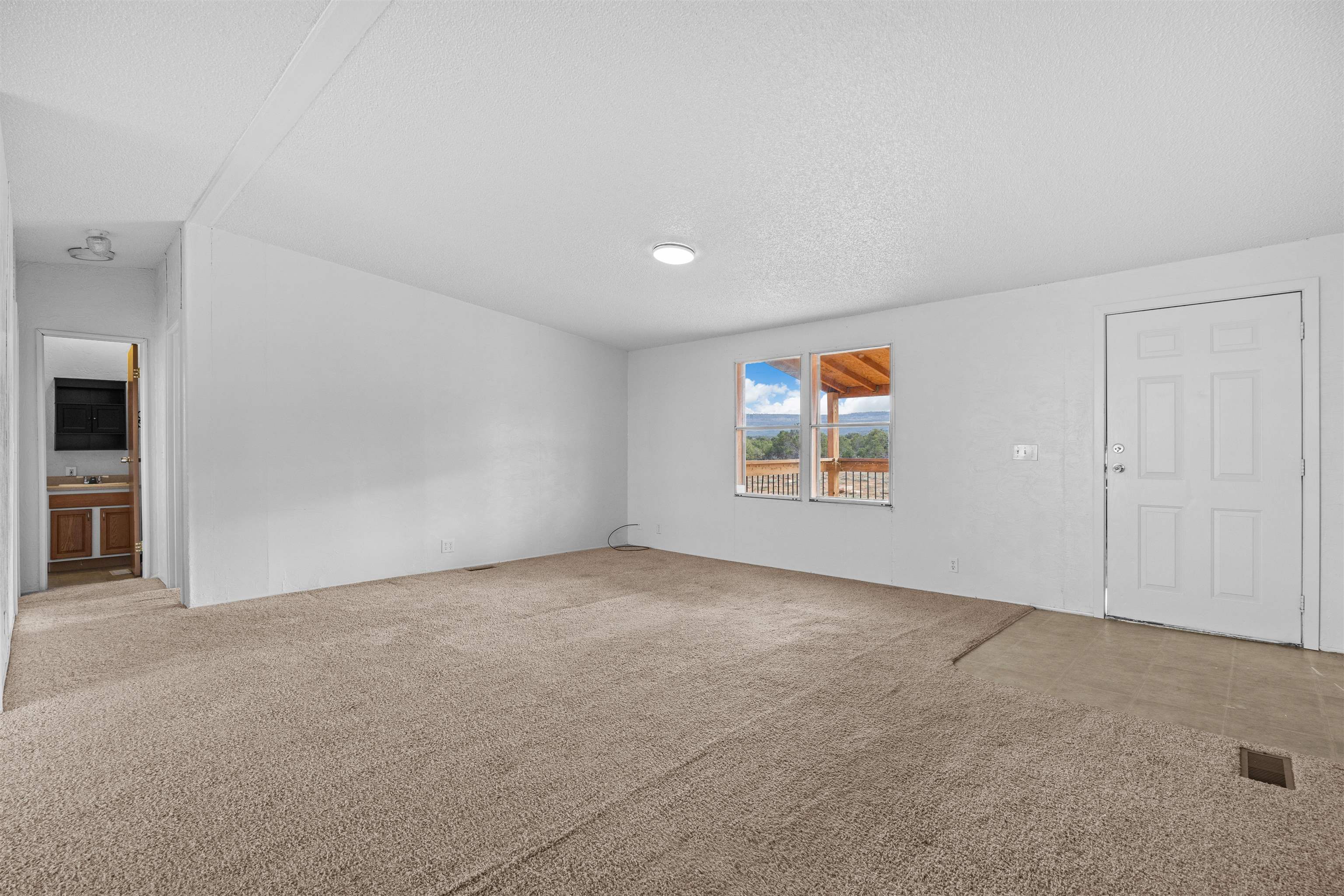 21431 Little Park Road Grand Junction, CO 81507 - Photo 32 of 40 an empty room with windows