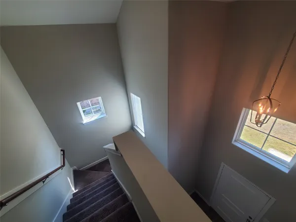 a view of a livingroom with windows