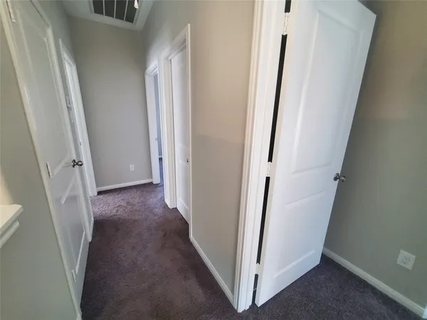 a view of a hallway and stairs