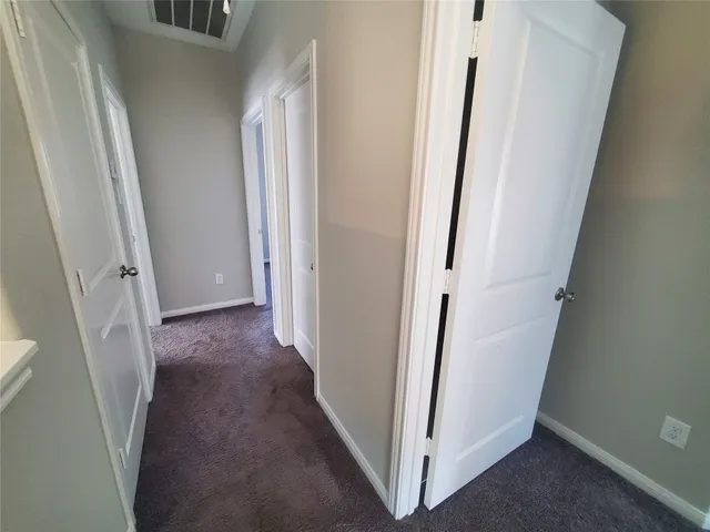 a view of a hallway and stairs