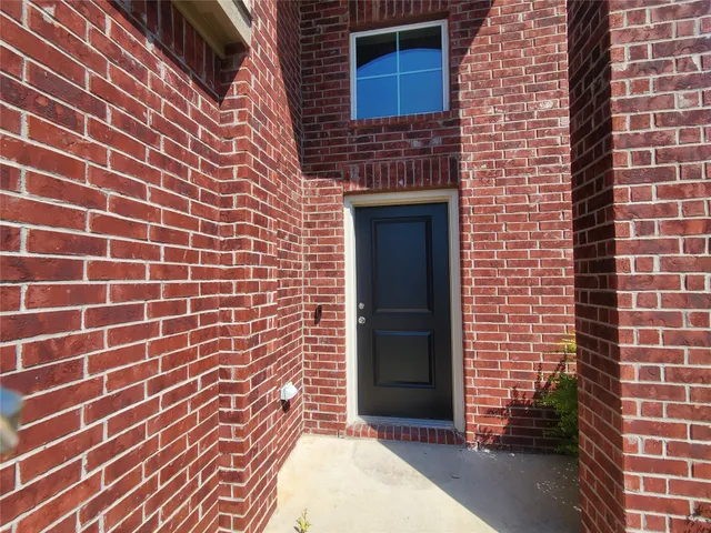 a brick building with a door