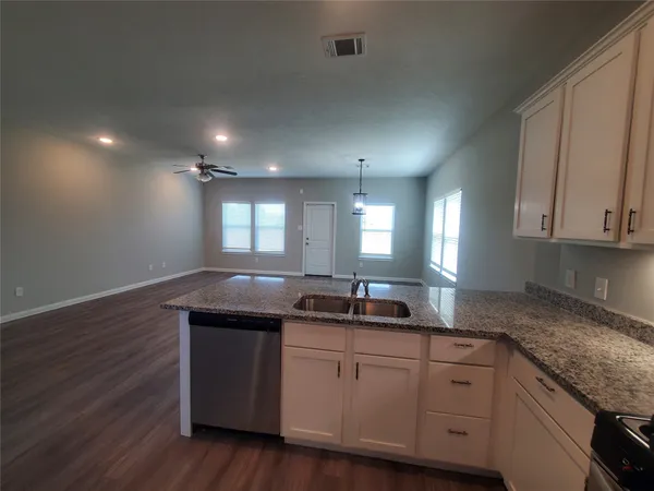 a kitchen with a sink and cabinets