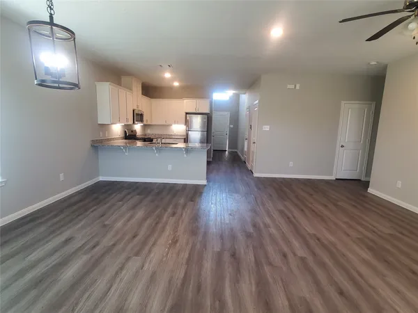 a room with wooden floors and view living room