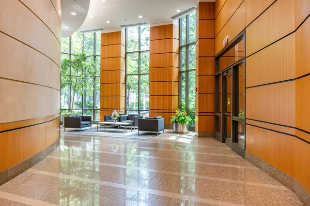 a view of a kitchen with a sink and microwave