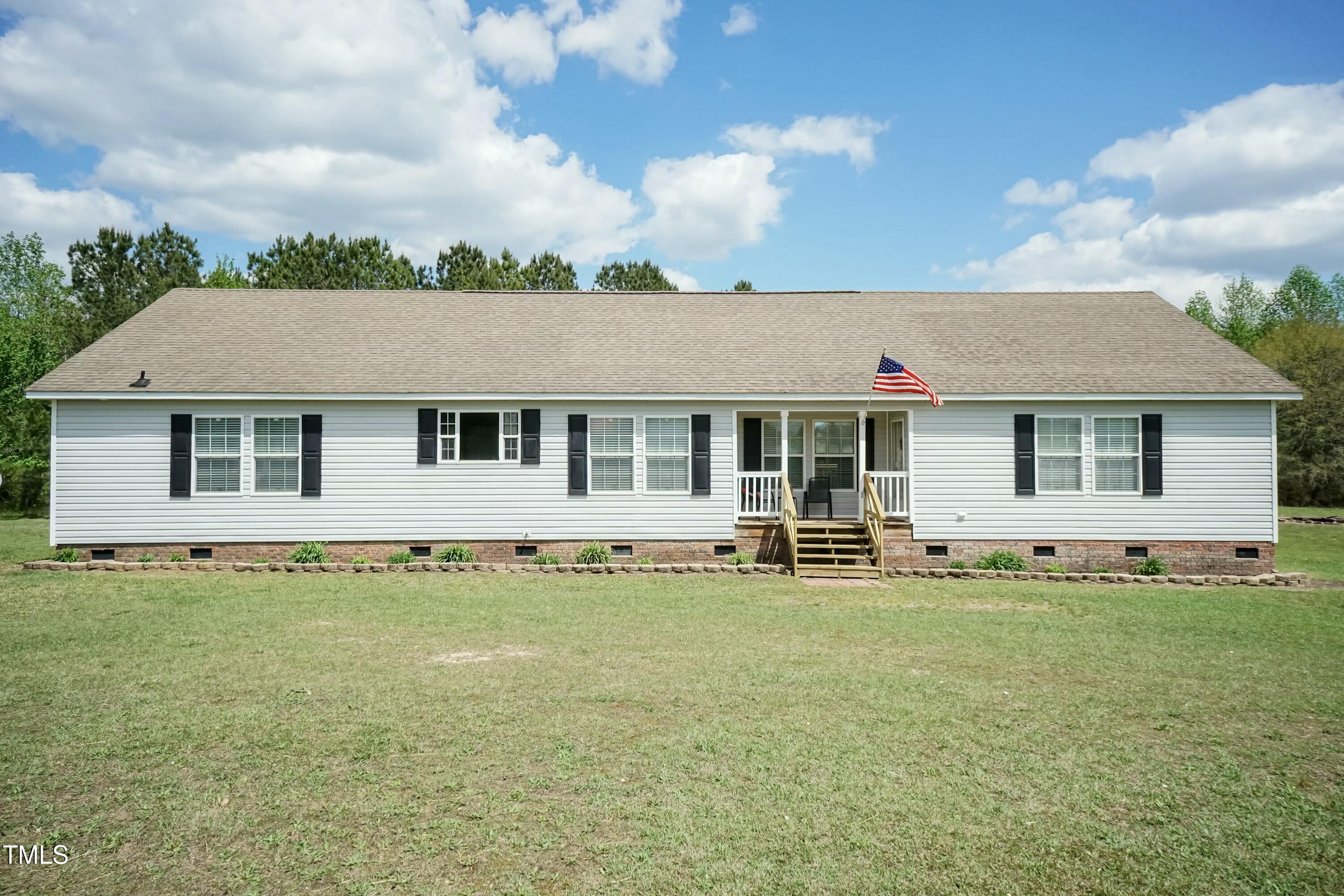 front view of a house with a garden