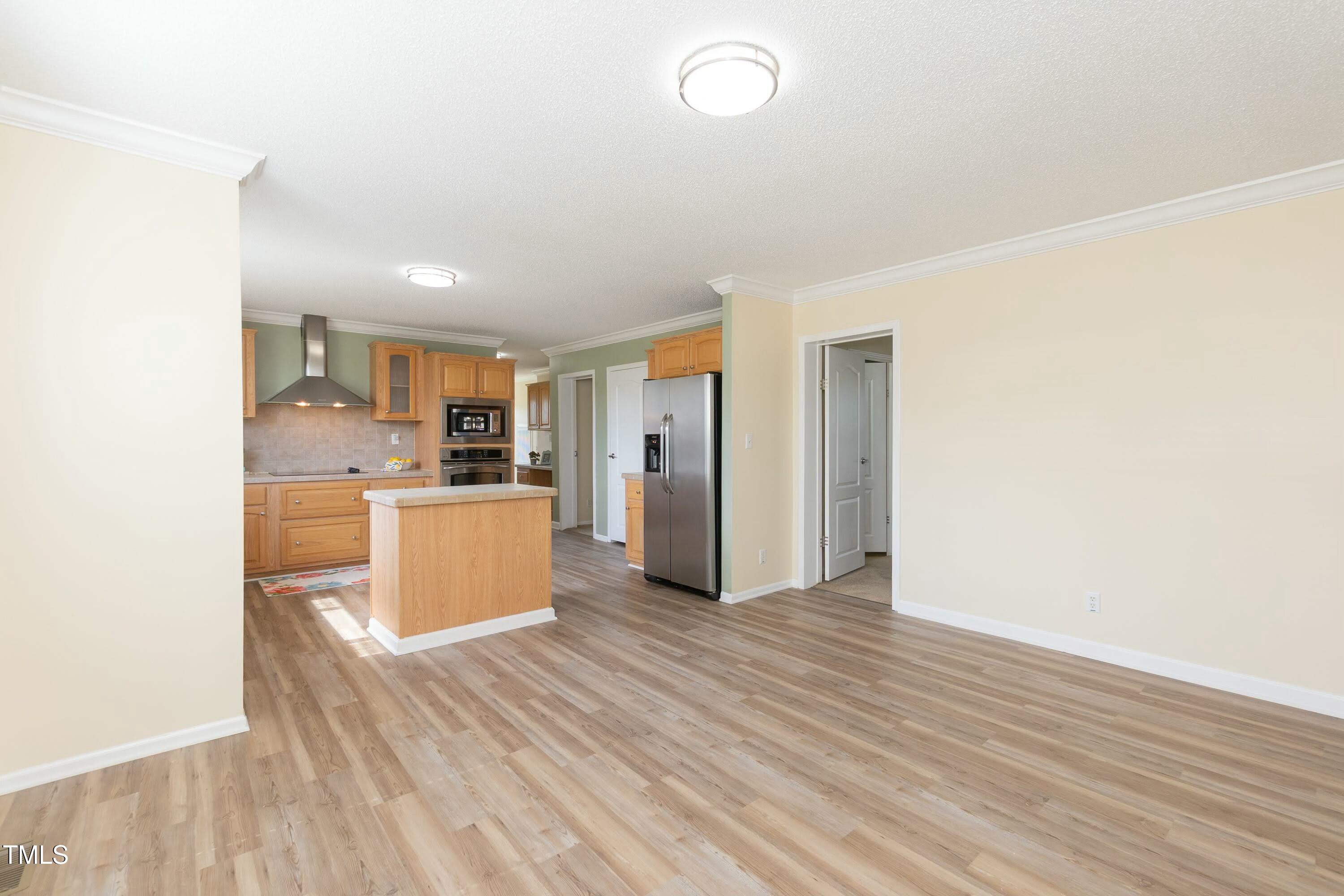 660 Our Way Linden, NC 28356 - Photo 10 of 36 a view of a kitchen with wooden floor