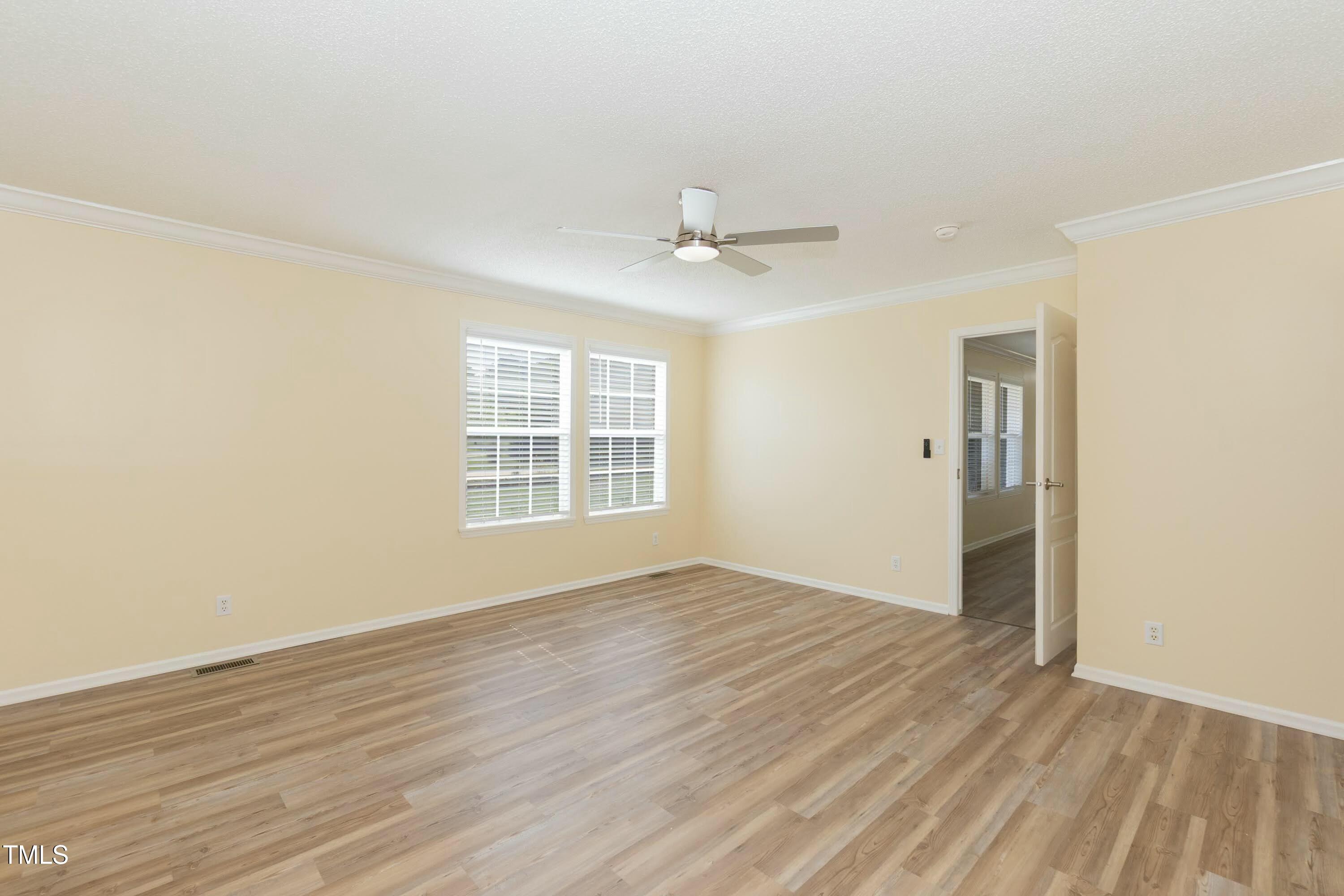 660 Our Way Linden, NC 28356 - Photo 17 of 36 wooden floor in an empty room with a window
