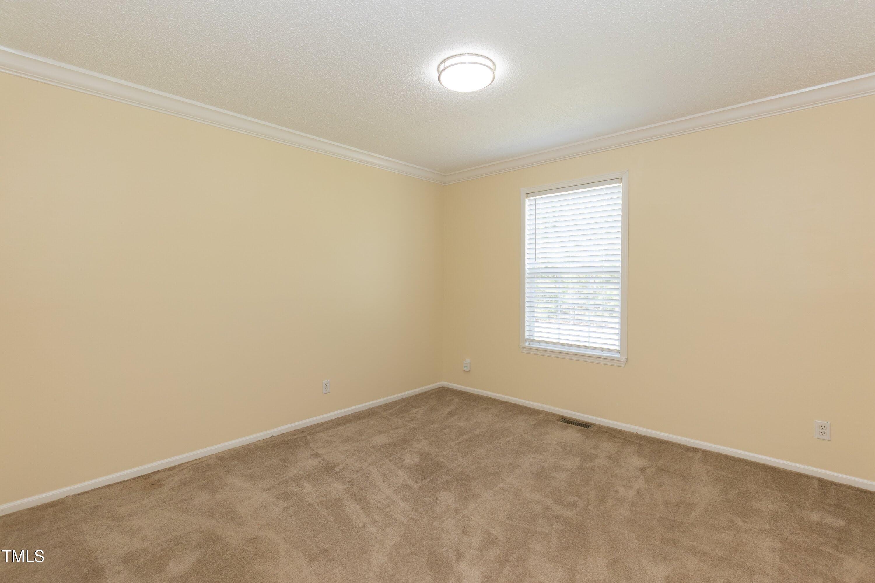 660 Our Way Linden, NC 28356 - Photo 23 of 36 an empty room with a window