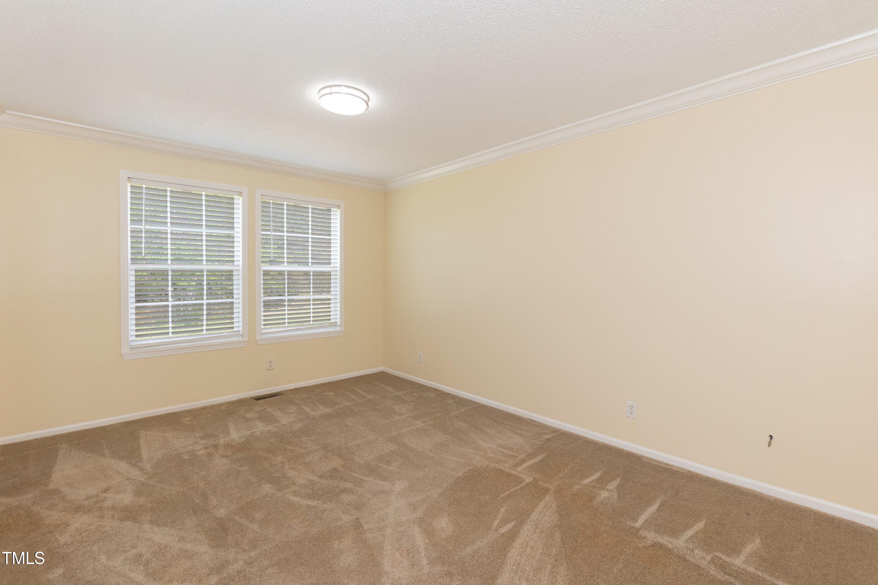 660 Our Way Linden, NC 28356 - Photo 24 of 36 an empty room with windows