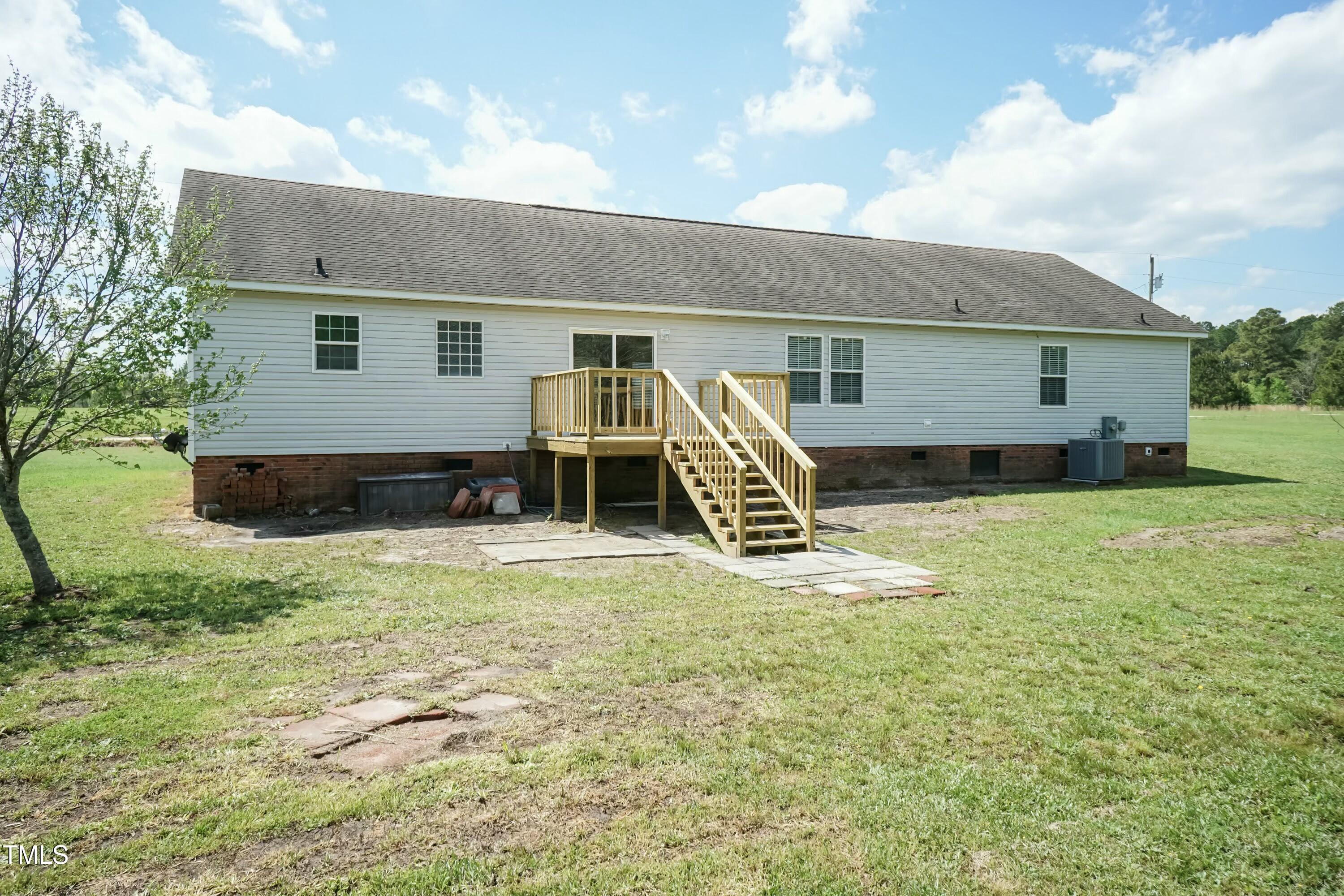 660 Our Way Linden, NC 28356 - Photo 29 of 36 a view of a house with a backyard