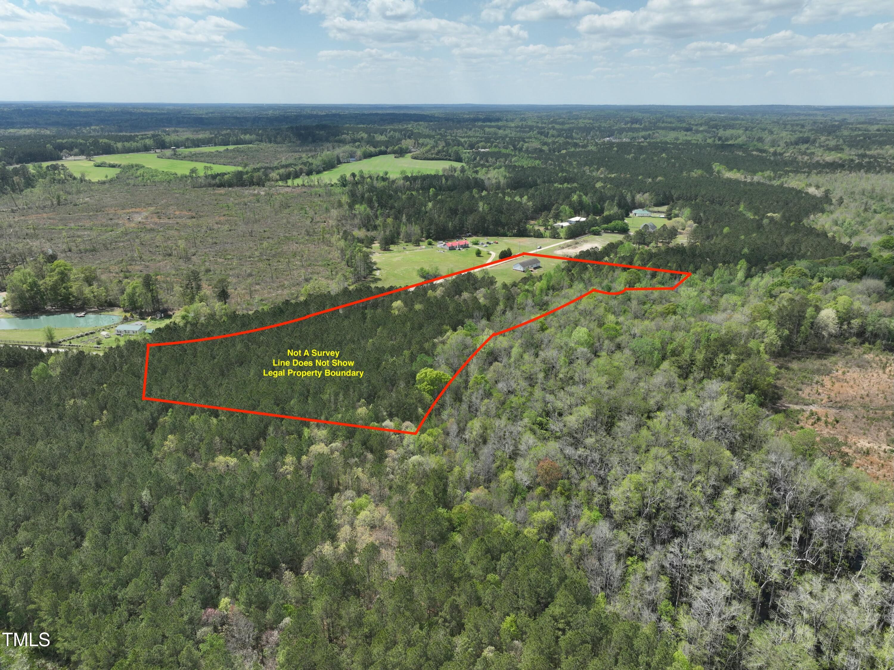 660 Our Way Linden, NC 28356 - Photo 34 of 36 an aerial view of residential houses with outdoor space and trees