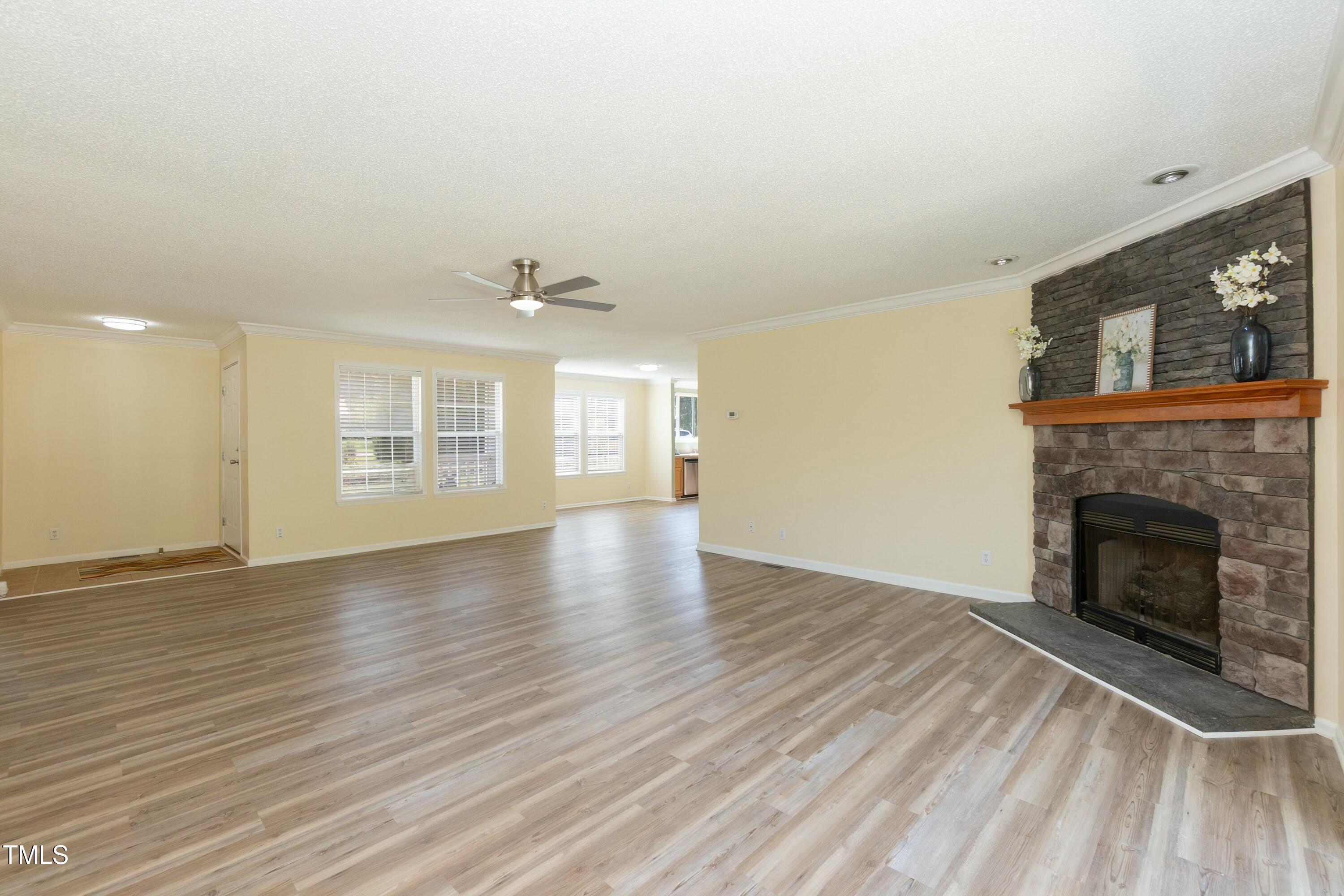 660 Our Way Linden, NC 28356 - Photo 6 of 36 a view of an empty room with wooden floor and a window