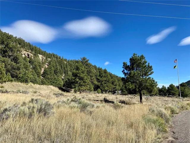 a view of a backyard with mountain view