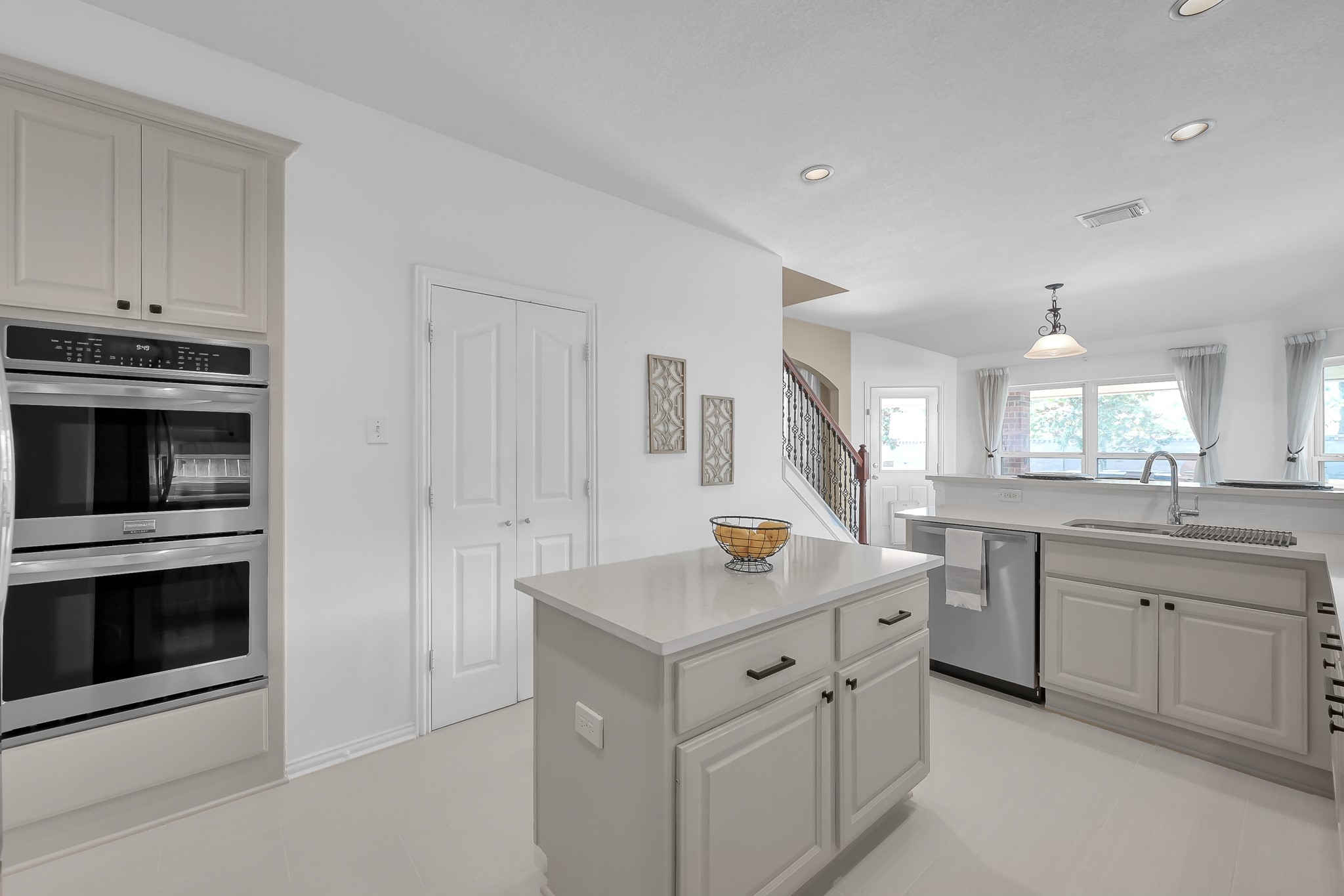14730 Ramblebrook Humble, TX 77396 - Photo 12 of 48 a kitchen with granite countertop white cabinets and stainless steel appliances