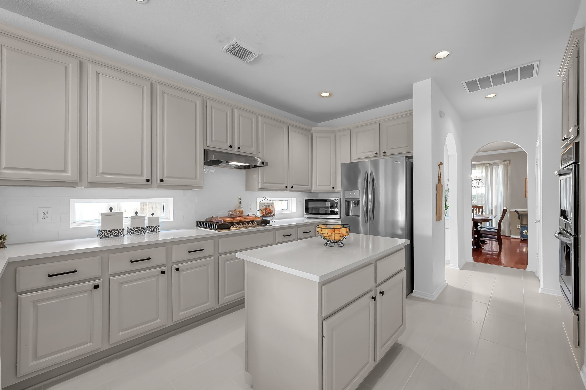 14730 Ramblebrook Humble, TX 77396 - Photo 14 of 48 a kitchen with cabinets and stainless steel appliances