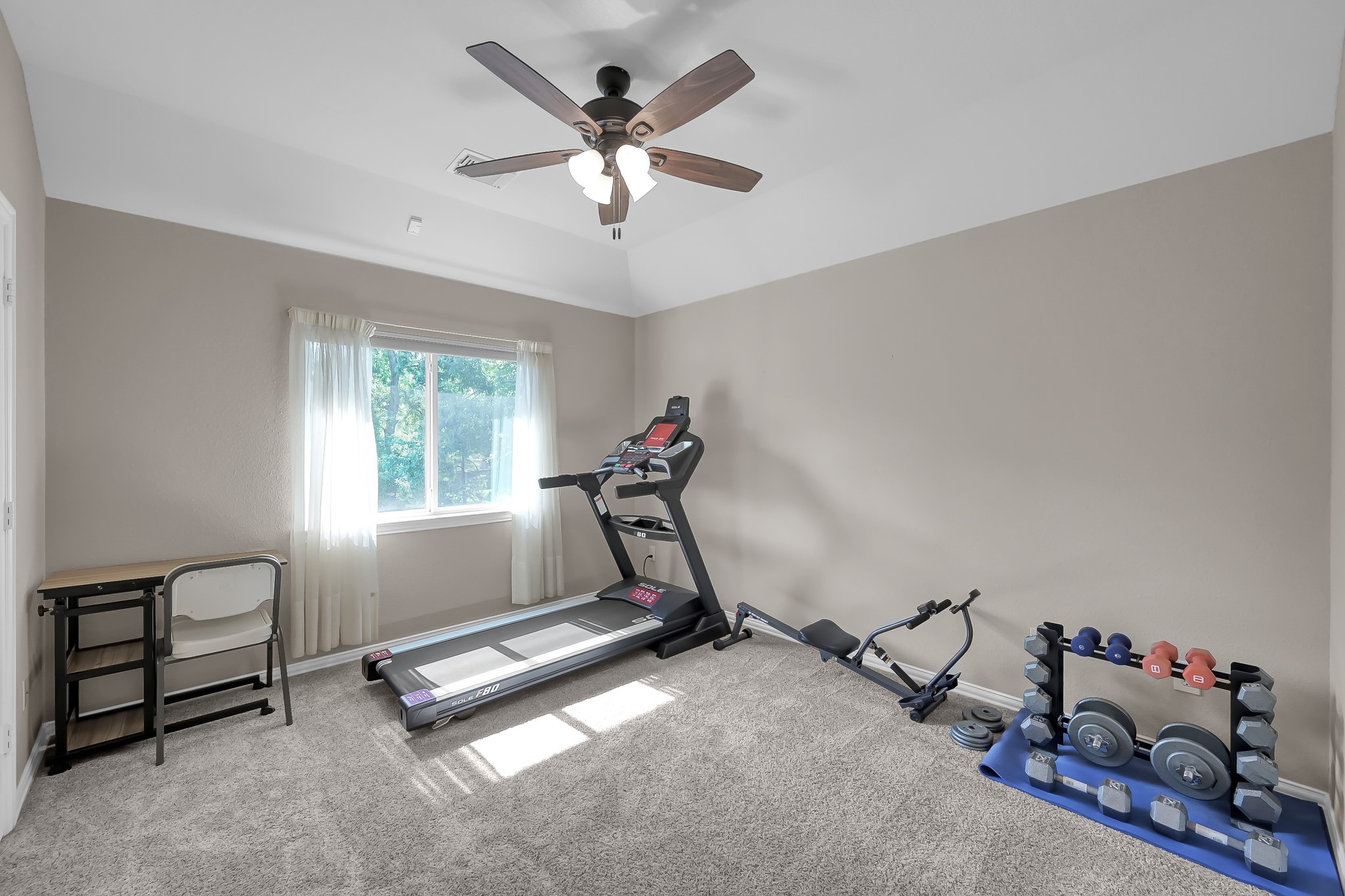 14730 Ramblebrook Humble, TX 77396 - Photo 27 of 48 a room with gym equipment and a window