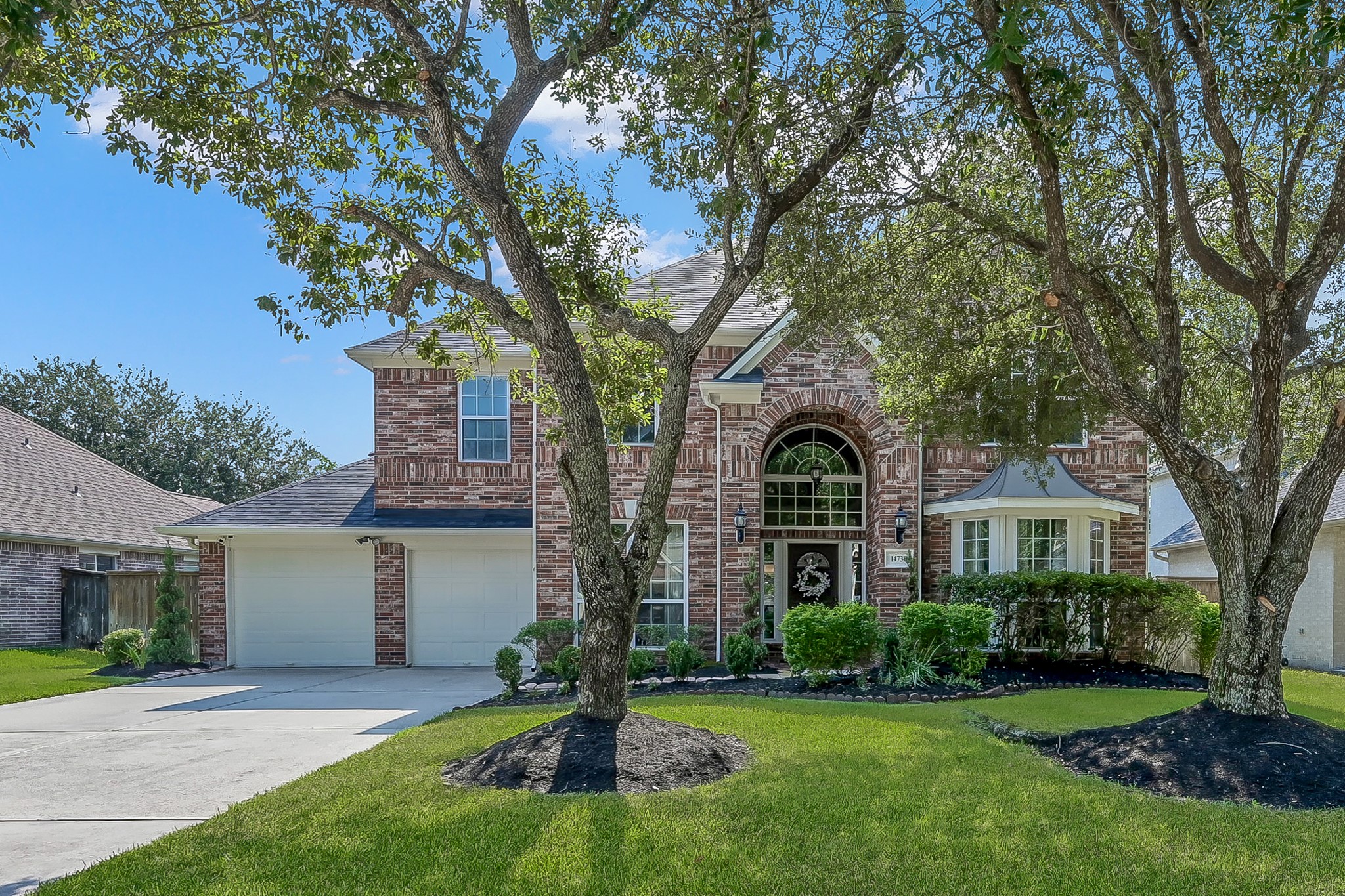 14730 Ramblebrook Humble, TX 77396 - Photo 34 of 48 a front view of a house with a garden and trees