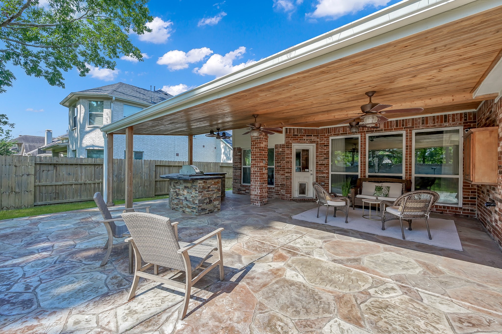 14730 Ramblebrook Humble, TX 77396 - Photo 5 of 48 a view of a patio with a table and chairs under an umbrella