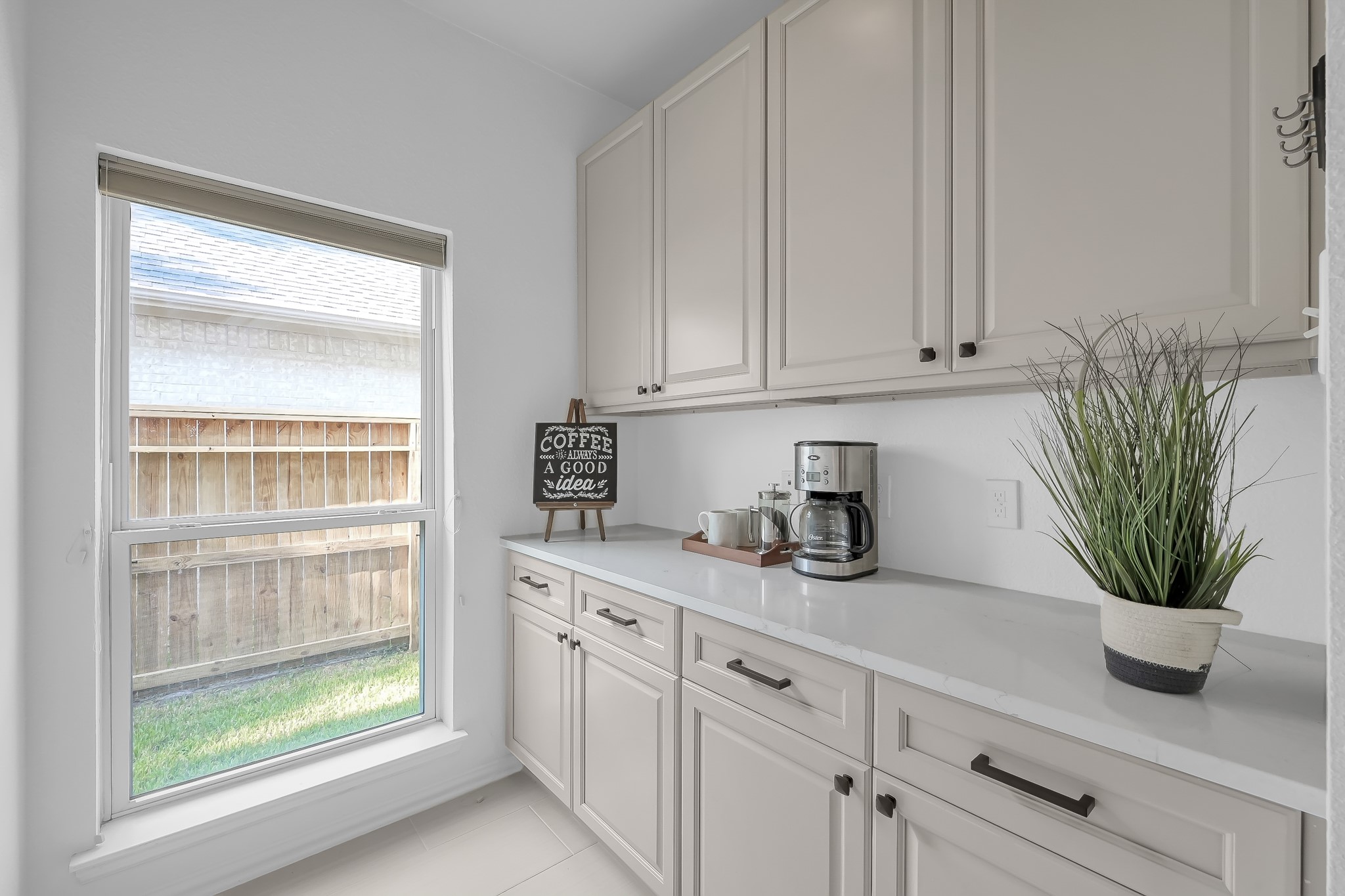14730 Ramblebrook Humble, TX 77396 - Photo 10 of 48 a kitchen with stainless steel appliances white cabinets and a window
