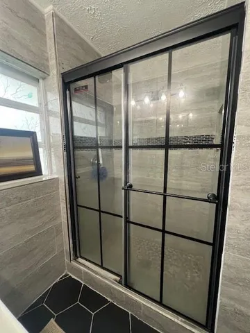 a bathroom with a glass door