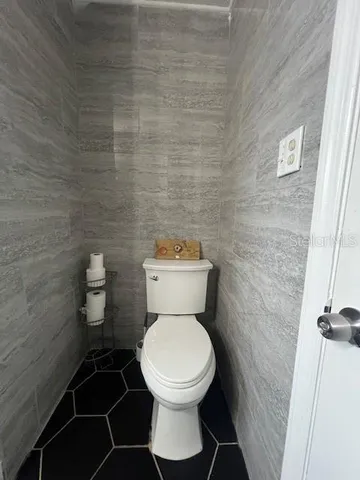 a bathroom with a toilet and a sink