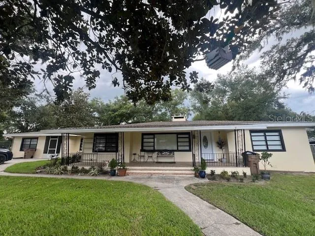 a front view of house with yard patio and green space