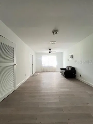 a view of empty room with a fireplace